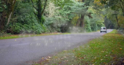 Minivan entering frame on road causing dotted binary overlay showing tech data, Stock Footage 331820292