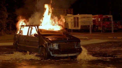 Minivan on Fire in Parking Lot Stock Footage 128250640