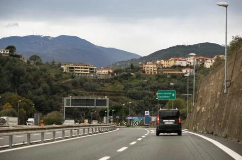 Minivan on the highway. Stock Photos