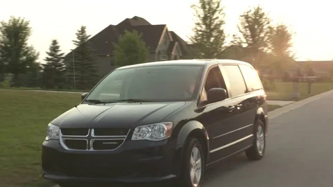 Minivan pulling away Video stock 77073578