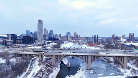 Minneapolis cityscape featuring downtown architecture, I-35W bridge, and a Stock Footage 327636218