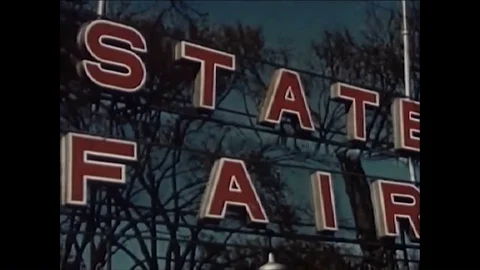 The Minnesota State Fair features crowds, rides, displays and exhibits about Stock Footage 86910019