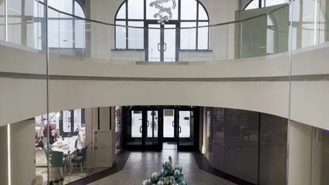 Minsk Belarus December 5 2025 descends in a glass elevator inside a shoppin.. Stock Footage 323251753