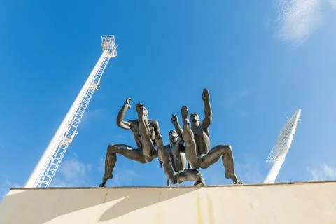Minsk, Belarus. Low-angle view of the bronze genre sculpture 'Run' atop the.. 스톡 사진