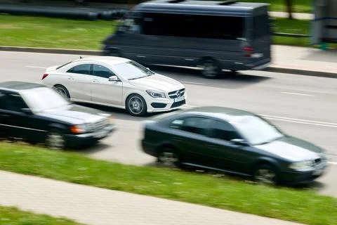 Minsk, Belarus - May 28 2021: White Mercedes-Benz CLA sedan C117 driving fast Stock Photos