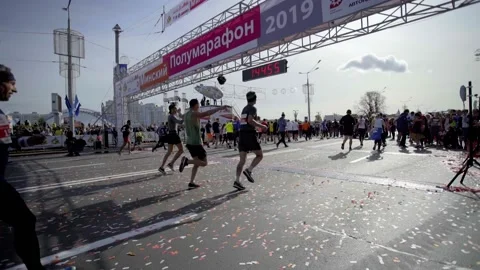 MINSK, BELARUS- SEPTEMBER 15, 2019: Runners finish the half marathon distance Stock Footage