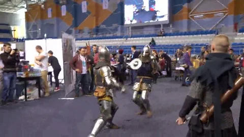 Minsk, October 2016, belarus Comic Con, two medieval knights fighting with each Stock Footage 69094718