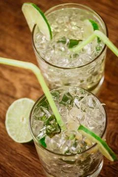 Mint and lime refreshing summer cocktails Stock Photos