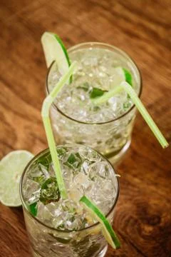 Mint and lime refreshing summer cocktails Stock Photos