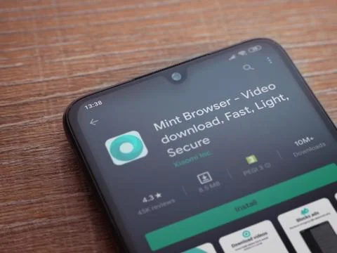 Mint Browser app play store page on the display of a black mobile smartphone  Stock Photos