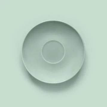 Mint color plates on mint table. Monochrome minimalistic image in hipster s.. Stock Photos