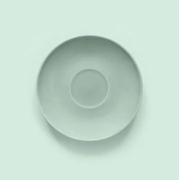 Mint color plates on mint table. Monochrome minimalistic image in hipster s.. Stock Photos