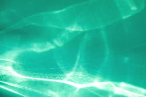 Mint colored abstract background with light and shadows caustic effect Stock Photos