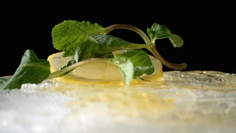 Mint flies off the ice with lemon Stock Footage 85860214