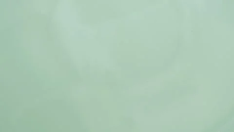 Mint green swirling fluid motion creating an abstract background with smoot.. Stock Footage 335139333