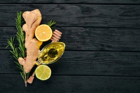 Mint, lime, ginger and lemon. On a wooden background. Top view. Copy space. Stock Photos