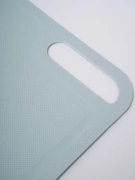 Mint plastic cutting board angled Stock Photos