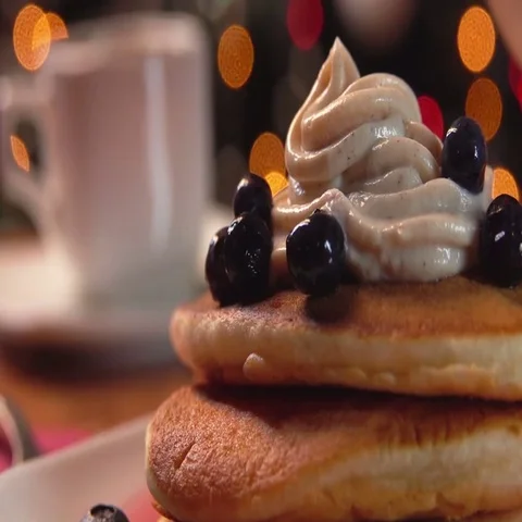 Mint syrup flows  on stack of pancakes Stock Footage 69507917