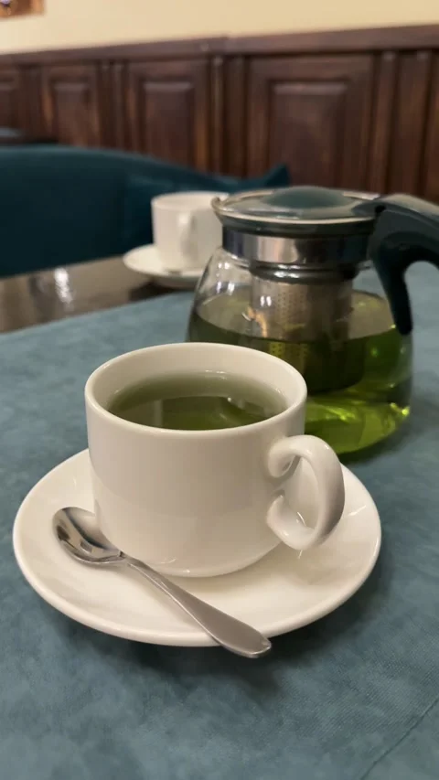 Mint tea green tea Green tea with currant leaves and mint in glass teapot and Stock Footage 324592345