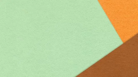 Mint textured paper background with orange brown triangular corners and cop.. Stock Photos