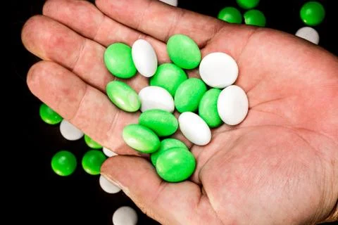 Mints in a hand's palm Stock Photos