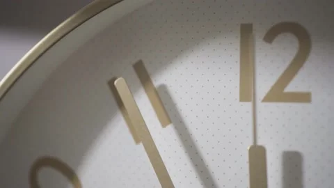 The minute hand points to the number 11, the second hand goes past. Stock Footage 162657773