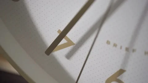 The minute hand points to the number 7, the second hand goes past. Stock Footage 162657545