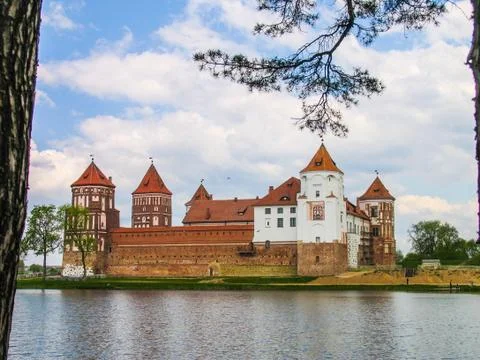 Mir, Belarus. Castle Complex Mir On Sunny Day with blue sky Background. Old Stock Photos