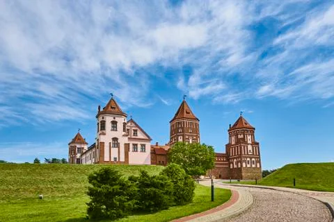 Mir castle complex in summer day with blue cloudy sky. Tourism landmark in Be Stock Photos