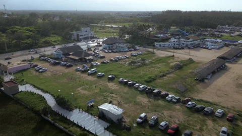 Miramar Beach parking area crowded with vehicles and beach visitors Stock Footage 342664227