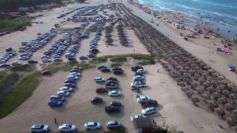 Miramar Beach parking area crowded with vehicles and beach visitors Stock Footage 342664246
