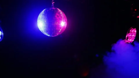 Mirror ball for disco on a black background in the rays of lighting. Stock Footage 100238314