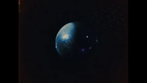 Mirror ball,disco ball,disco ball background close up. Shot on 8mm camera Stock Footage 129118050