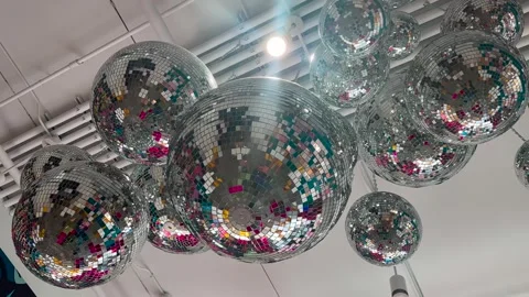 Mirror Balls Hanging from Ceiling - Light in Background Stock Footage 265511651