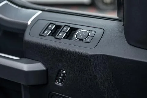 Mirror control knob and window control panel in a modern car. Automatic car w Foto stock