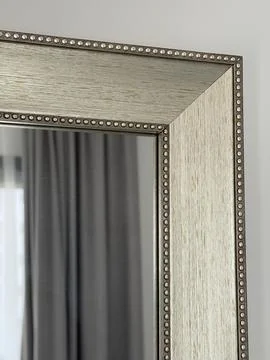 Mirror corner with textured frame and dotted edge detail suitable for inter.. Stock Photos