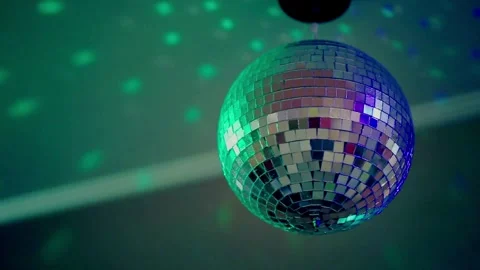 Mirror disco ball at the party reflecting the rays of light from the spotli.. Stock Footage 265759778