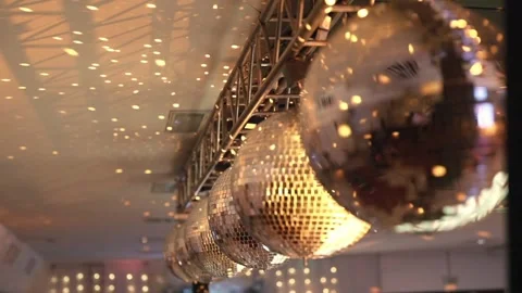 Mirror disco balls hanging from the ceiling creating sparkling party event Stock Footage 327466810