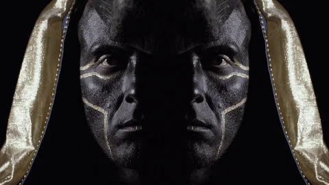 Mirror effect on the close up of Anubis with golden hood, dramatic lighting Stock Footage 115631569