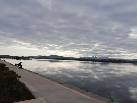 Mirror Effect Grey Sky Sardinia 库存照片