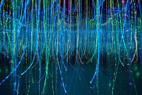 Mirror hallway filled with glowing strings Photos