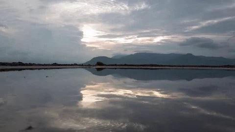 Mirror image cloud reflections on the salt fields of the south east Asia Stock Footage 79316350