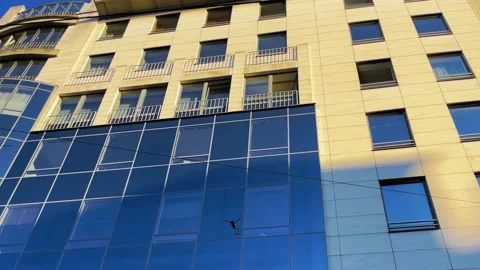 Mirror image of a helicopter in a set of windows Video stock 239279202