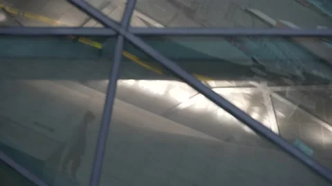 A mirror image of a model walking under the magnificent architecture of the East Stock Footage 201400014