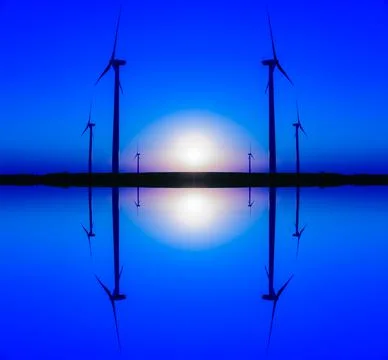 Mirror image silhouette of large wind turbine farm at sunset, Dexter, Minneso Stock Photos