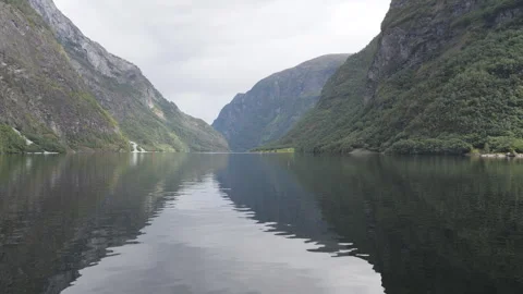 Mirror lake reflecting the high mountains in fjords. Stock Footage 254841744
