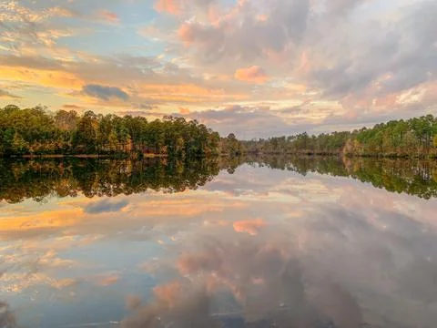 Mirror Lake reflection in fall with trees and clouds Stock Photos