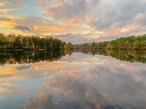 Mirror Lake reflection in fall with trees and clouds Stock Photos