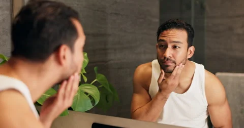 Mirror, man and beard care in bathroom for beauty, grooming and check skin with Stock Footage 337018405