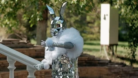  a mirror man in the form of a hare greets guests at the buffet table Stock Footage 263722980